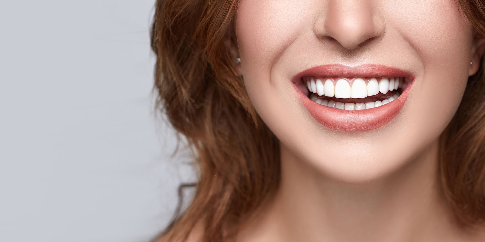 A happy smiling girl after getting dental bonding and tooth filling procedure at Sugarloaf Dental.