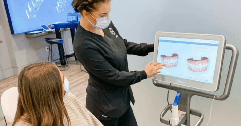 A dentist is discussing Invisalign's cost and price and whether Invisalign is cheaper than braces.